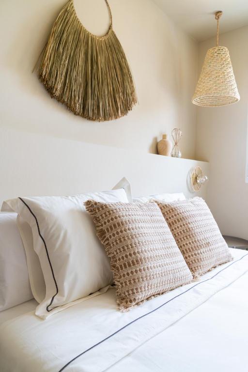 A bed or beds in a room at Jávea Boutique Suites - Holiday Apartments