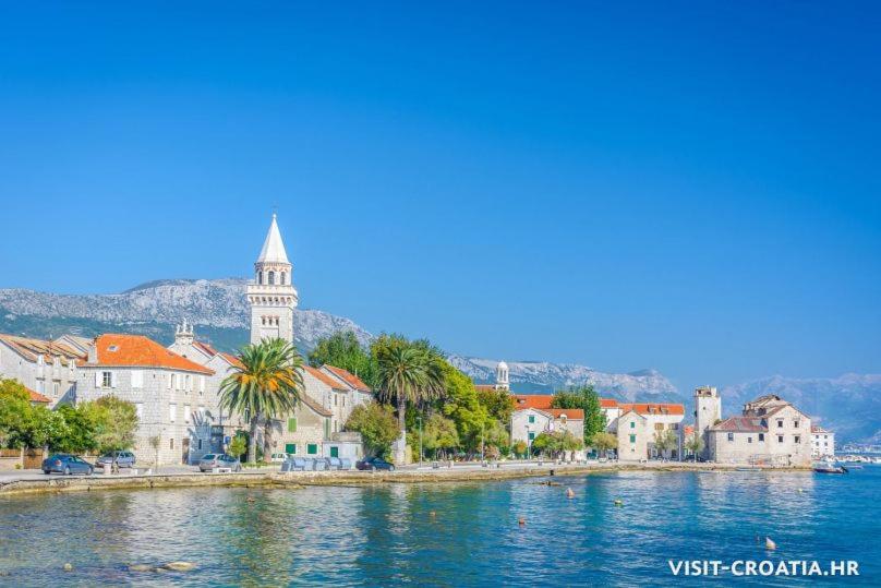 a view of a town on a body of water at Margareta's Apartment in Kaštela