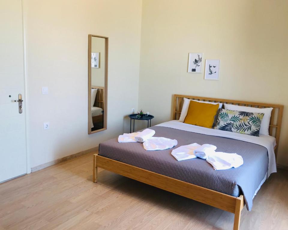 Postel nebo postele na pokoji v ubytování Kappa & Lamda Apartments