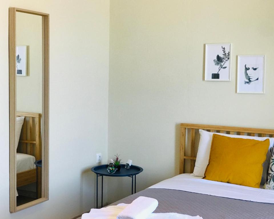 Postel nebo postele na pokoji v ubytování Kappa & Lamda Apartments