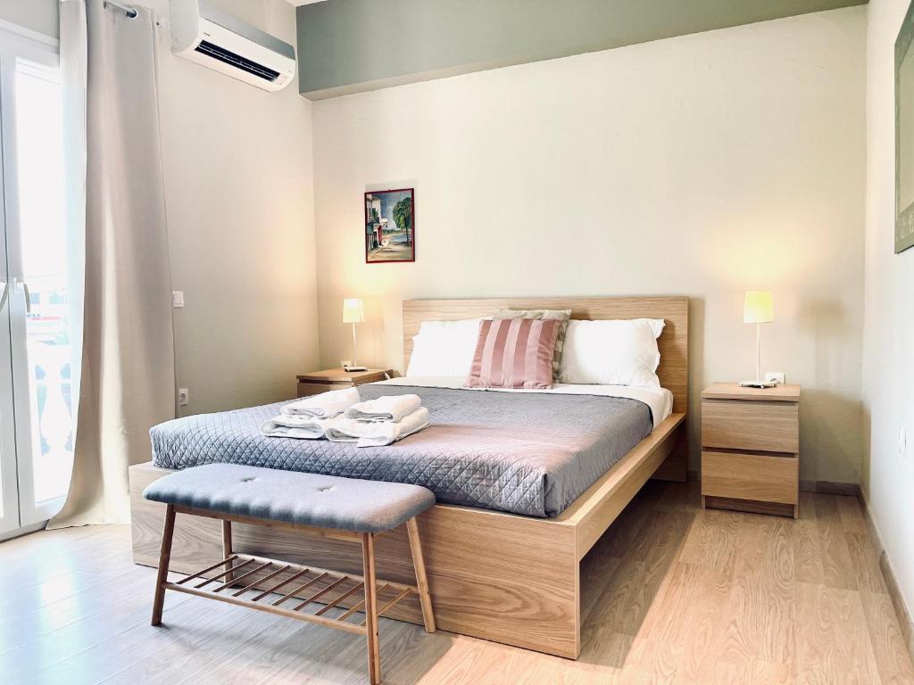 Postel nebo postele na pokoji v ubytování Kappa & Lamda Apartments