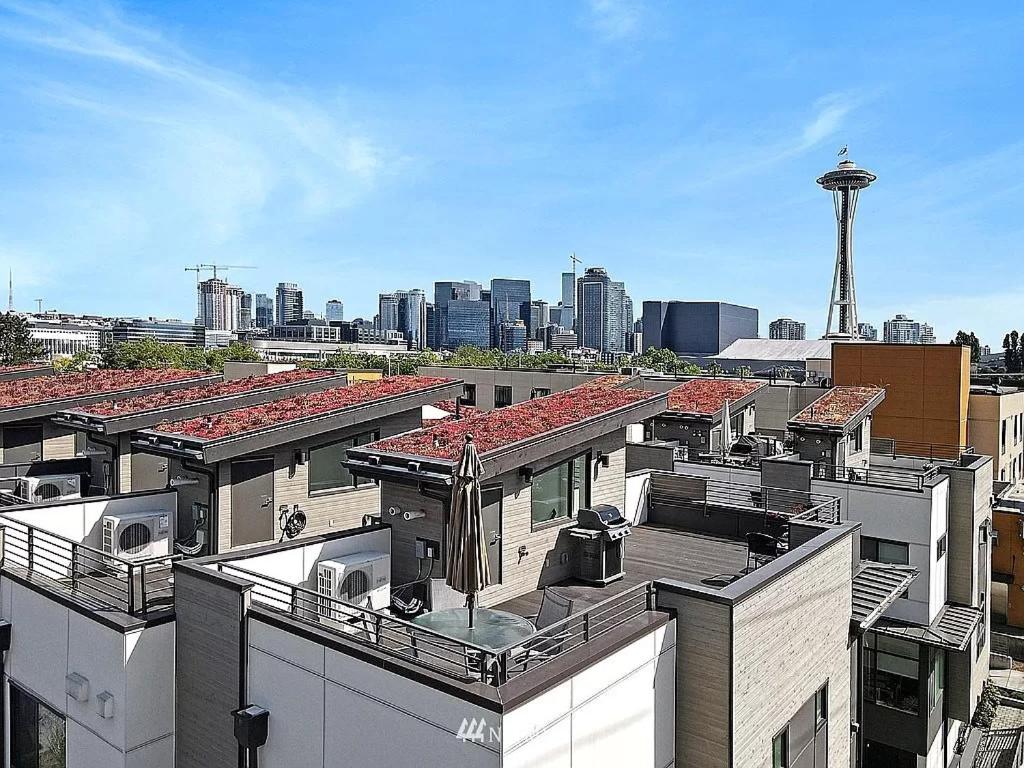 a view of roofs of buildings in a city at Deactivated- Rooftop Patio with Grill 2BR 3BA Central, Walkable Location in Seattle