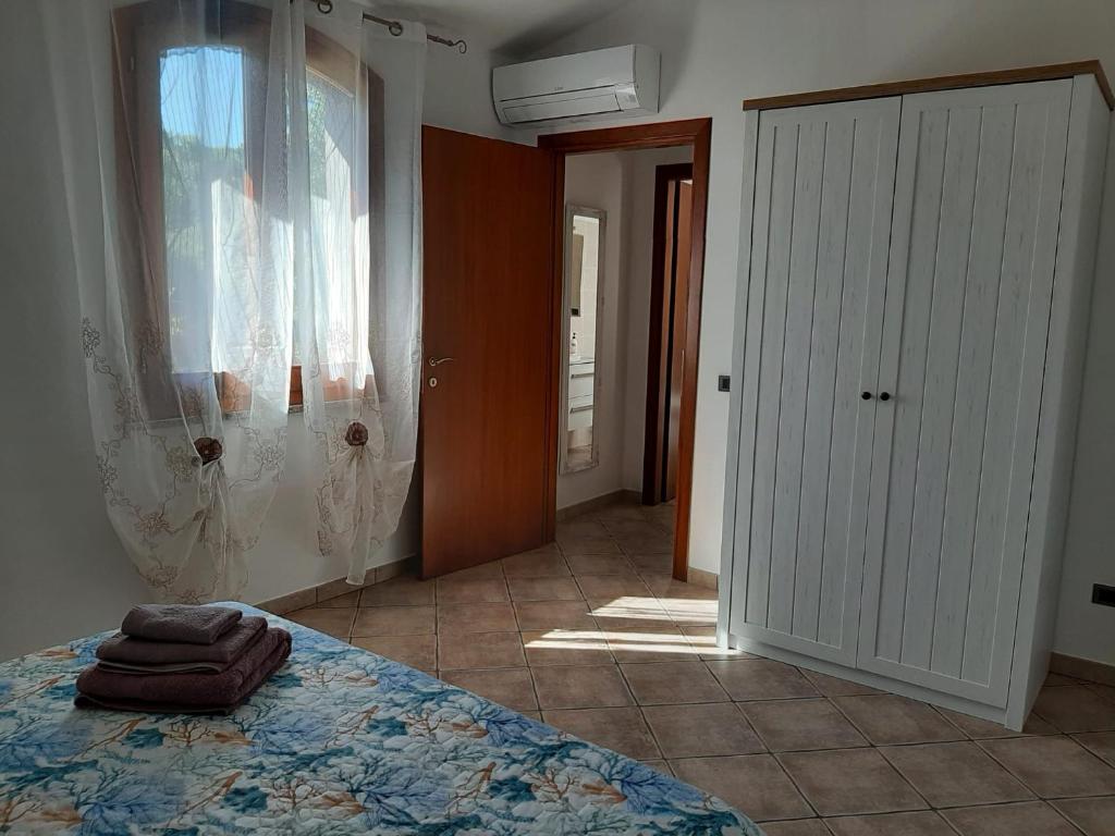 Postel nebo postele na pokoji v ubytování Il mirto e l'oleandro