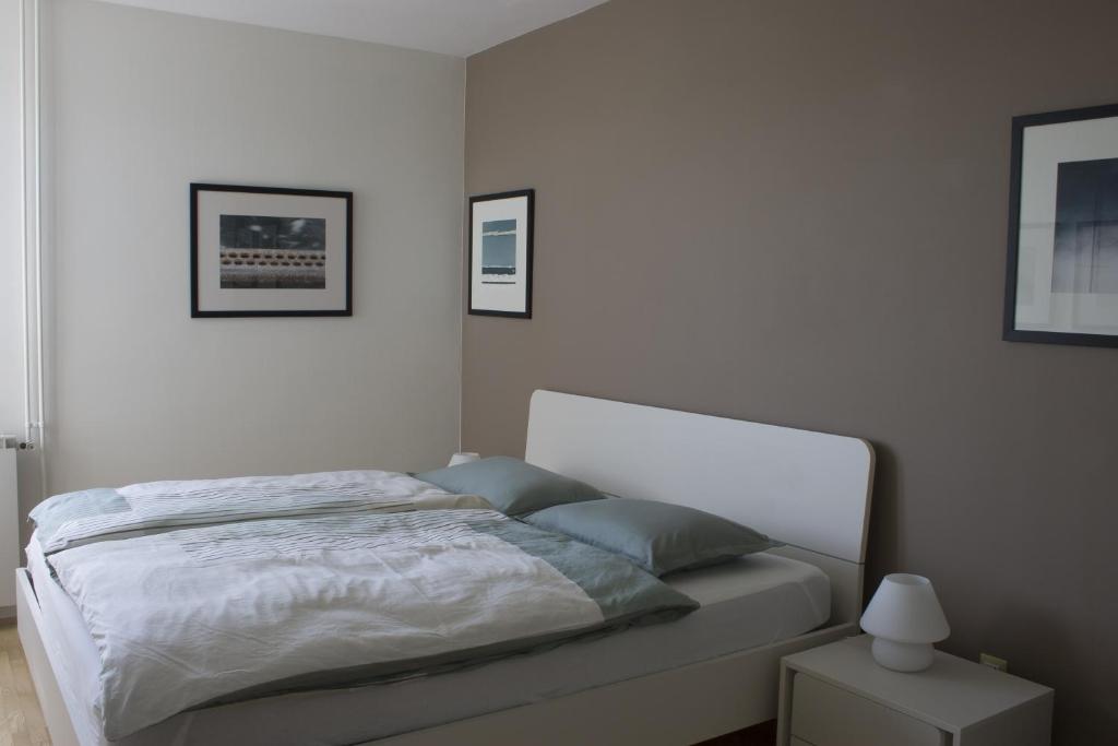 Postel nebo postele na pokoji v ubytování Apartments Tim