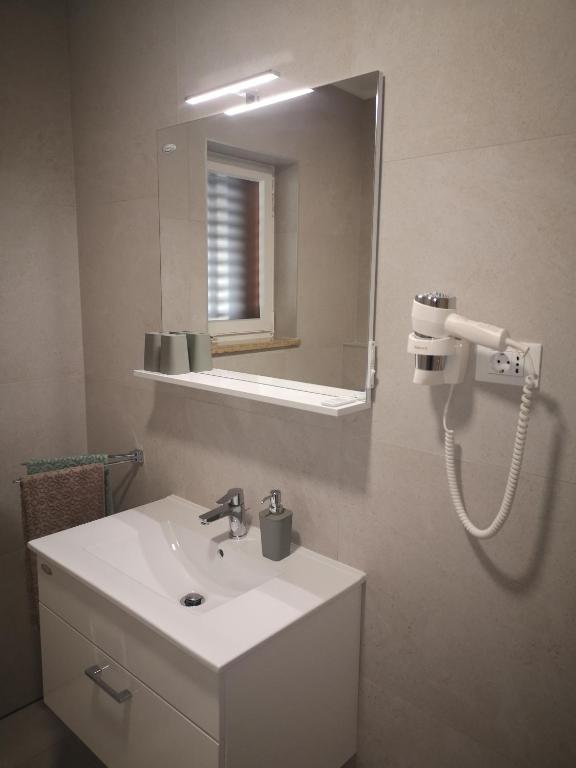 Koupelna v ubytování Apartments Tim