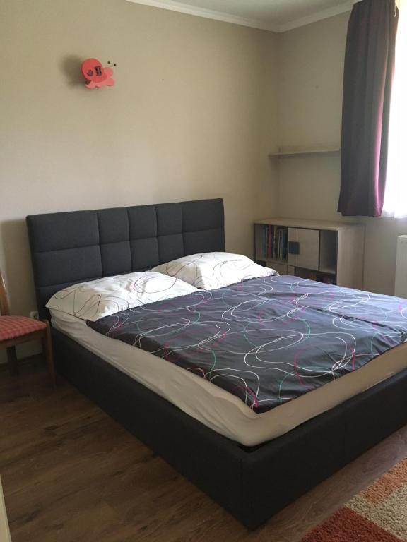 Postel nebo postele na pokoji v ubytování Holiday Vendégház