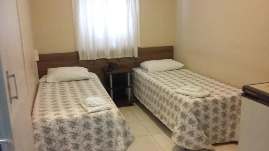 Postel nebo postele na pokoji v ubytování Hotel Excelsior