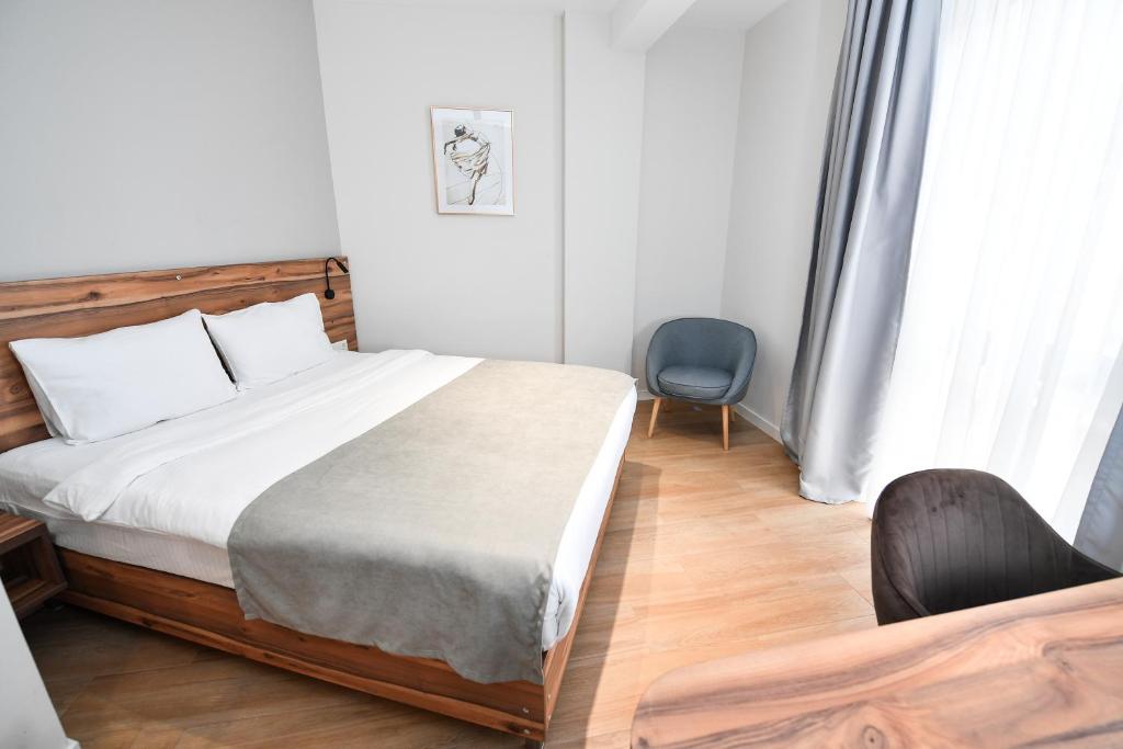 Postel nebo postele na pokoji v ubytování Address Boutique Hotel