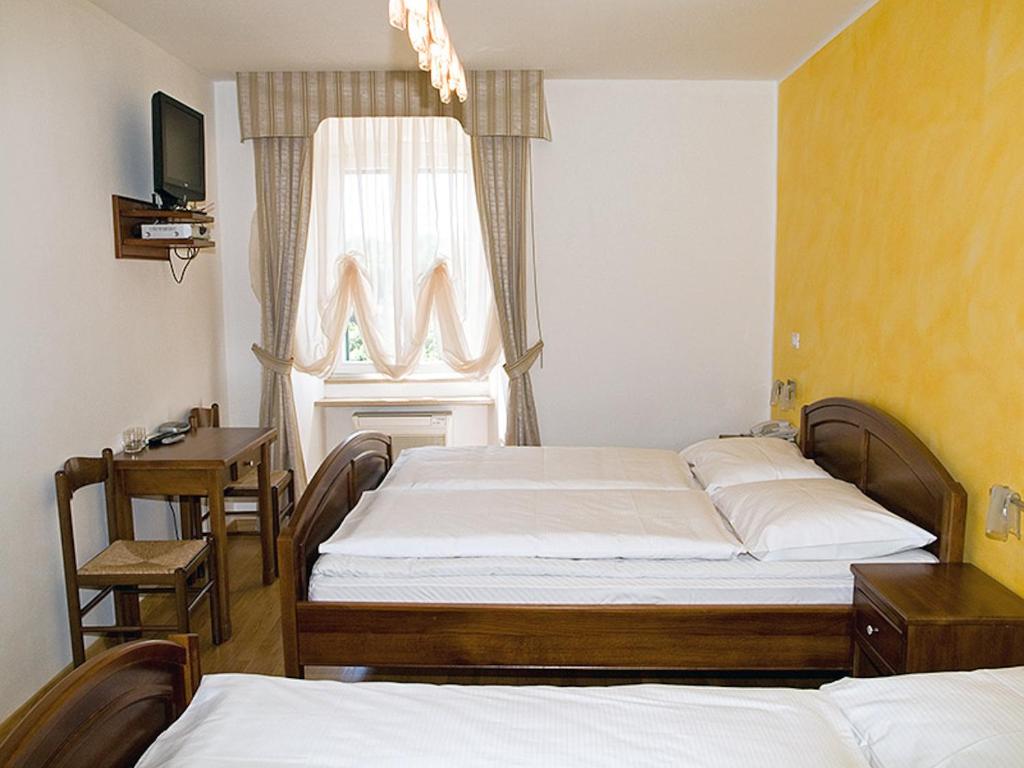 Postel nebo postele na pokoji v ubytování Bed&Breakfast Kvarner