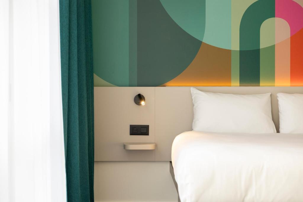 Postel nebo postele na pokoji v ubytování B&B HOTEL Hasselt