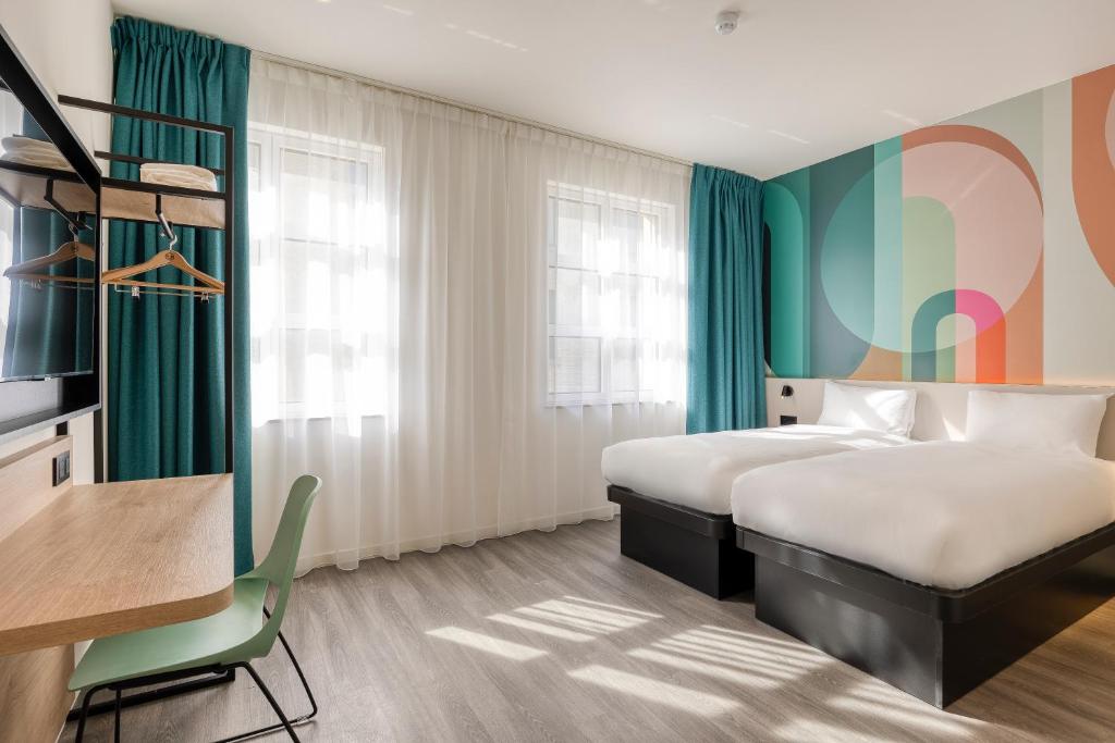 Postel nebo postele na pokoji v ubytování B&B HOTEL Hasselt