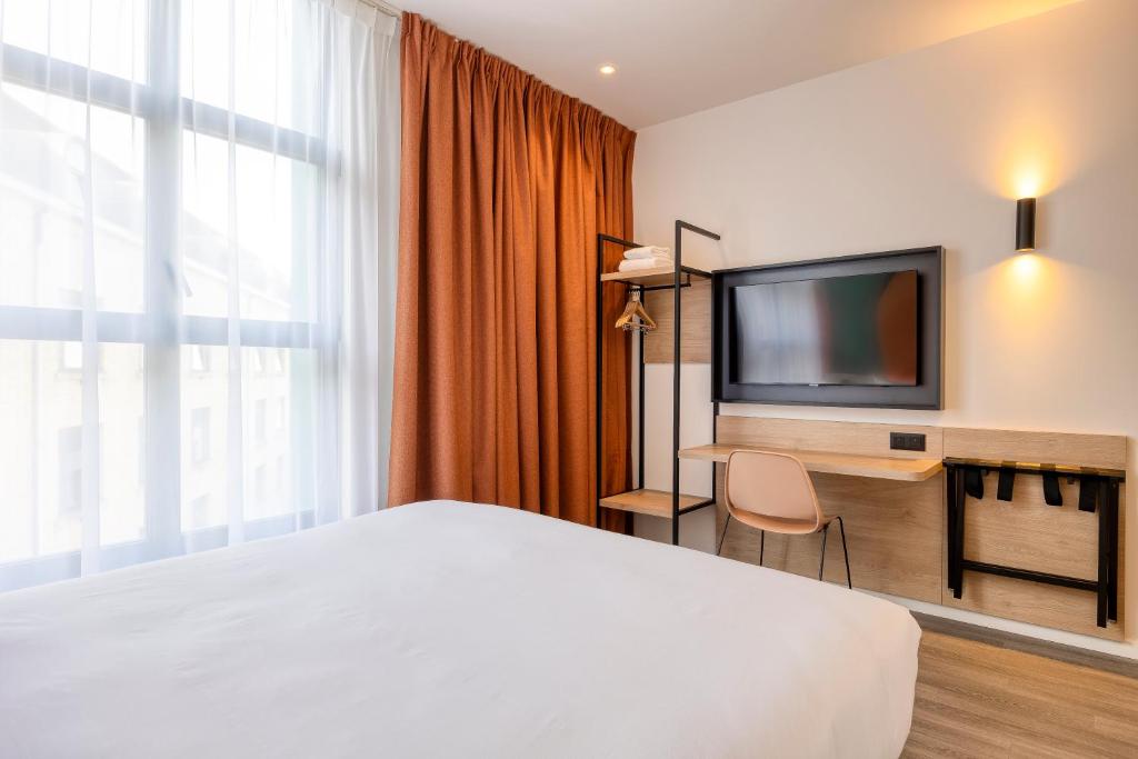 TV a/nebo společenská místnost v ubytování B&B HOTEL Hasselt