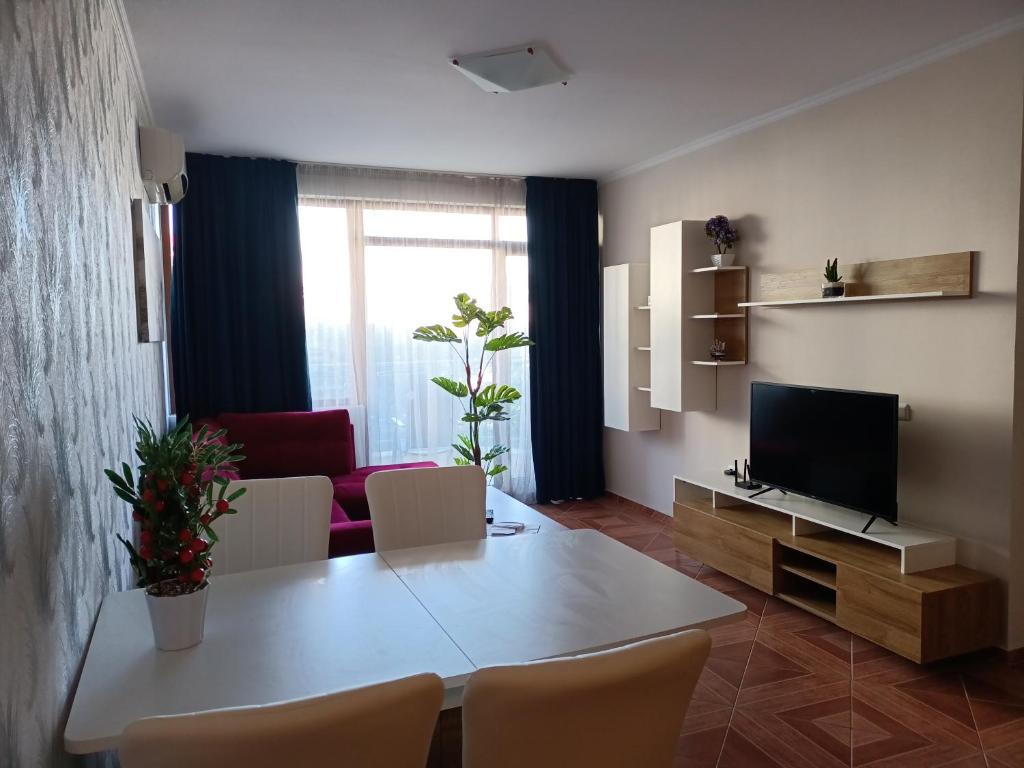 A television and/or entertainment centre at Sun Wave EXCLUSIVE