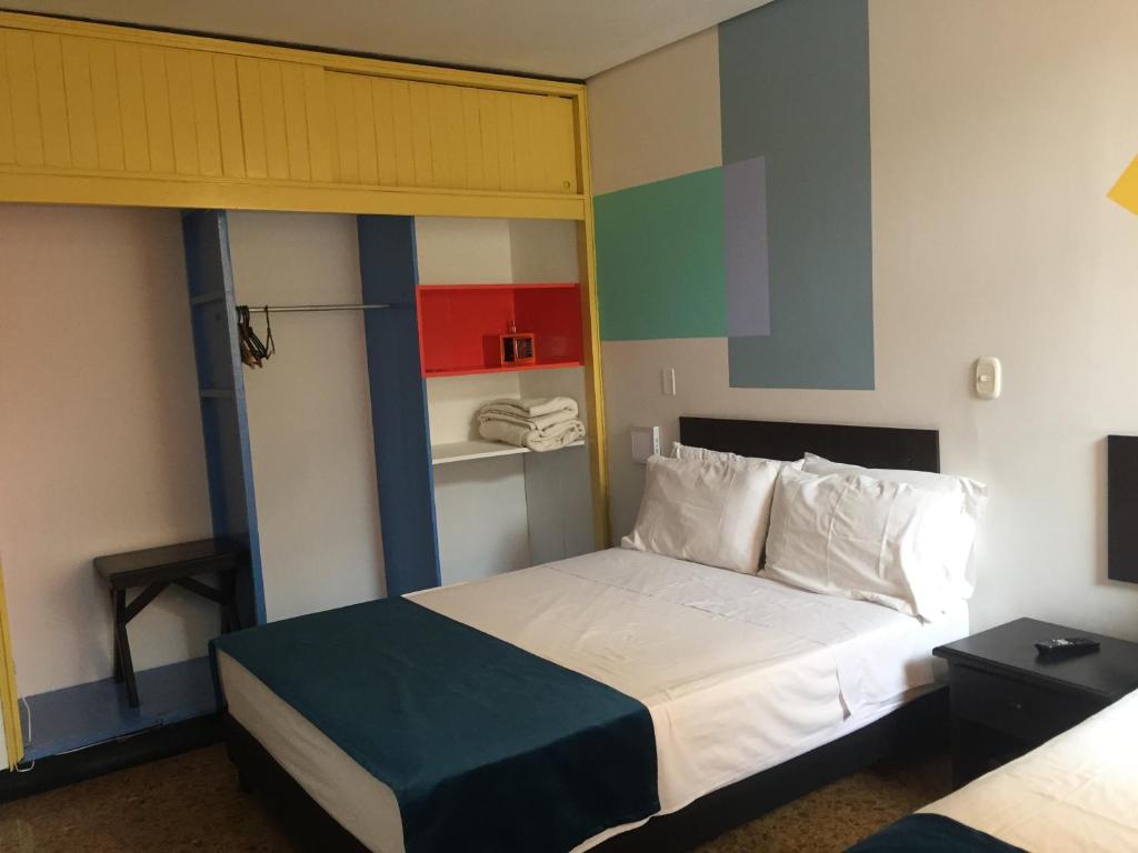 Postel nebo postele na pokoji v ubytování Hotel San Fermin Pereira