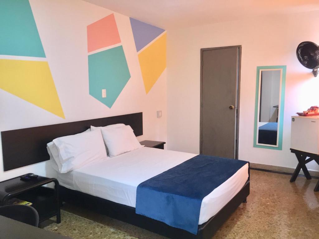 Postel nebo postele na pokoji v ubytování Hotel San Fermin Pereira