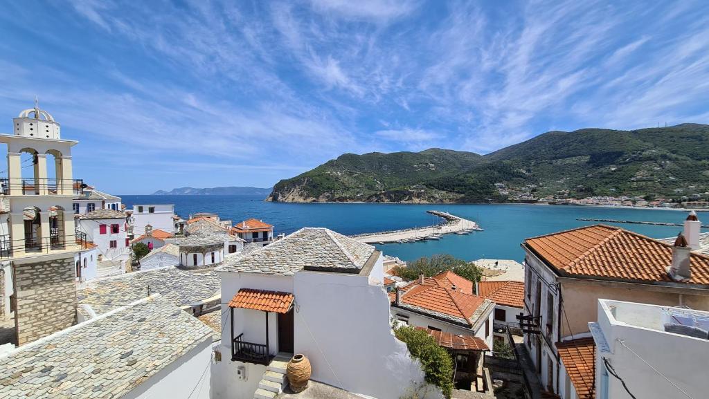 a view of a town and a body of water at Townhouse Christos in Panormos Skopelos