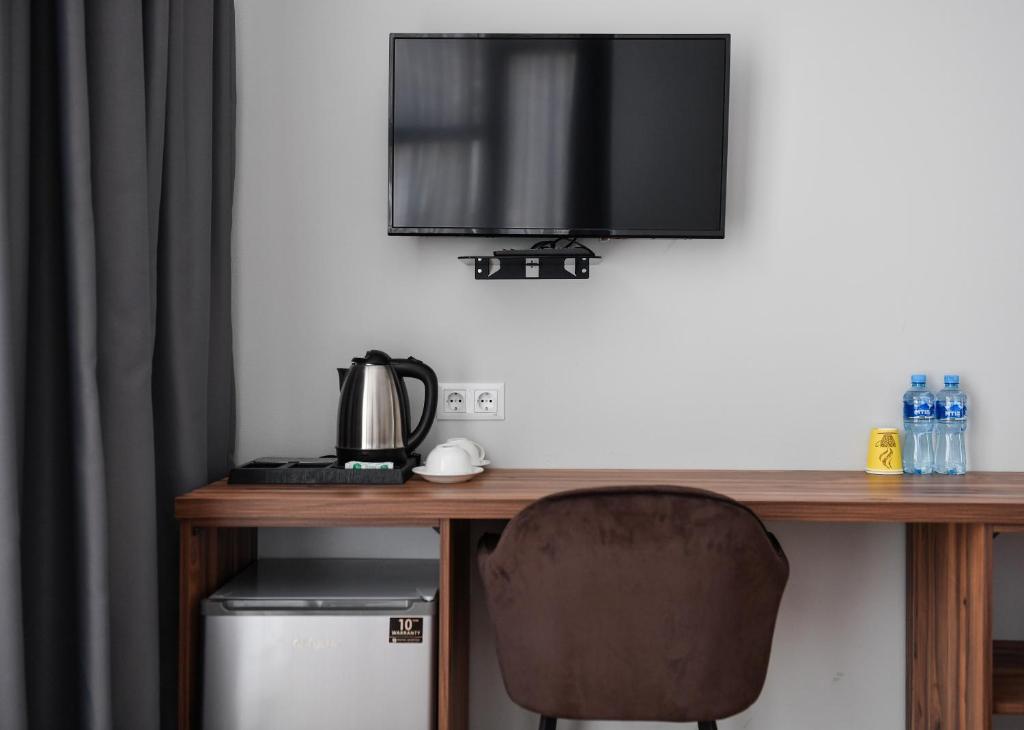 Příslušenství pro přípravu čaje a kávy v ubytování Address Boutique Hotel