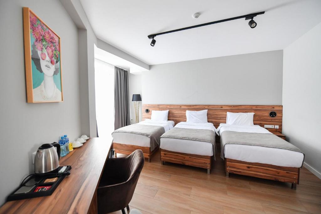 Postel nebo postele na pokoji v ubytování Address Boutique Hotel