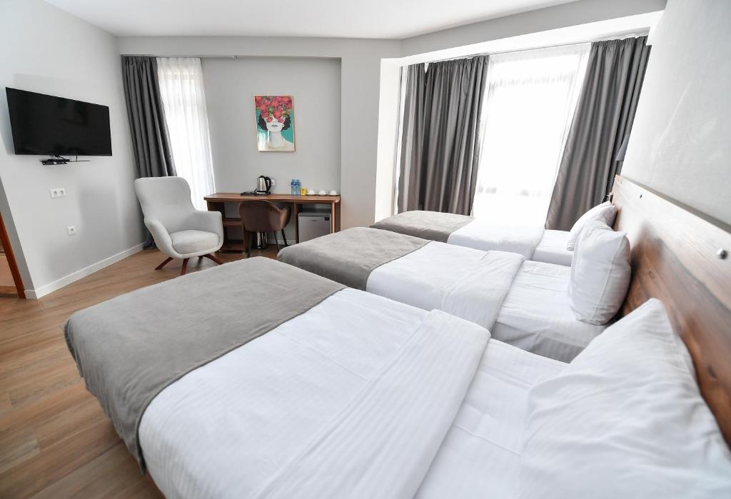 Postel nebo postele na pokoji v ubytování Address Boutique Hotel