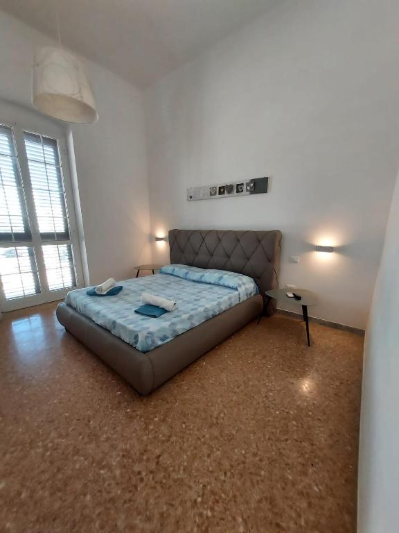 Postel nebo postele na pokoji v ubytování Dimora Trinity - Central Rooms
