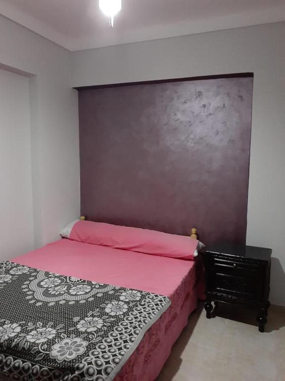 A bed or beds in a room at Free Wi-Fi شقة فندقية فى الاسكندرية New apartment sea view Alexandria