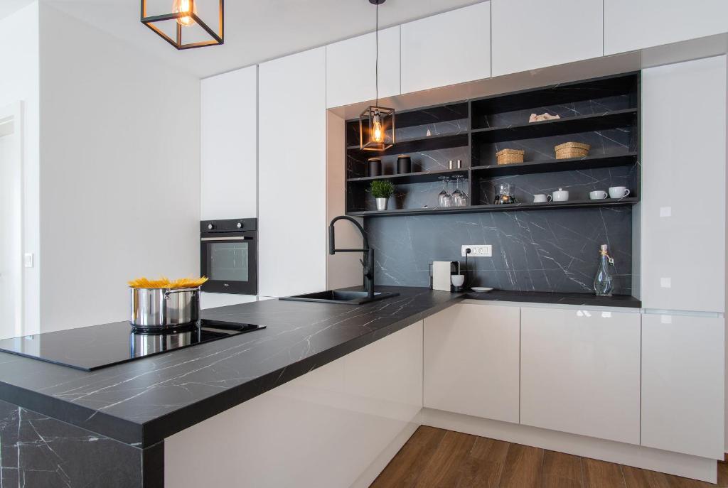 Kuchyň nebo kuchyňský kout v ubytování Apartment Mia Šimuni