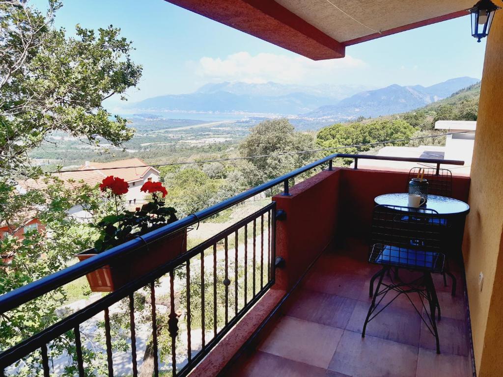 a balcony with a table and a view at Apartment Macic Dub II in Kotor
