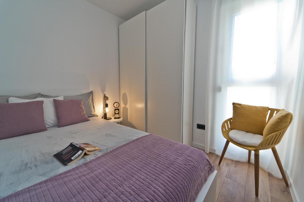 Łóżko lub łóżka w pokoju w obiekcie MaLeMi apartment
