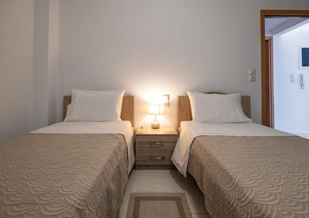 A bed or beds in a room at Filocsenia luxury apartment at tsoutsouras