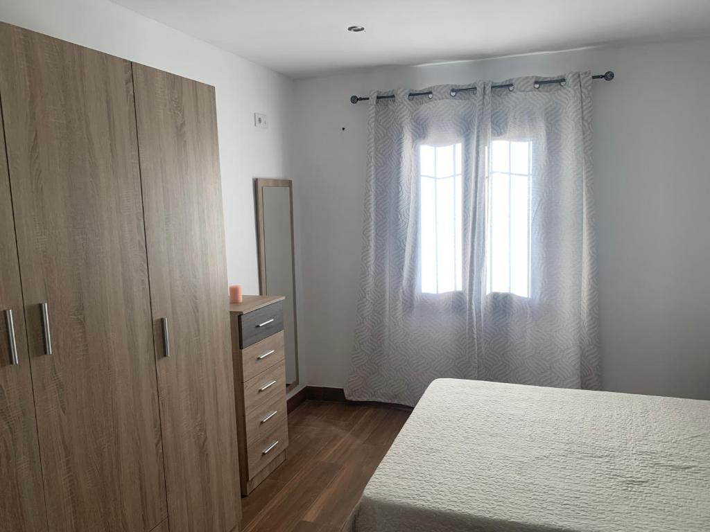Łóżko lub łóżka w pokoju w obiekcie Alojamiento Rural Cortijo Alameda, Las Lagunillas