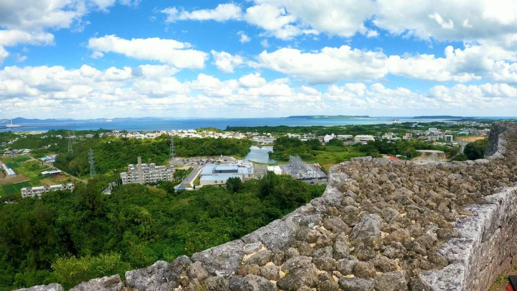 a view of a city from the walls of a castle at Crown Hotel Okinawa in Okinawa City