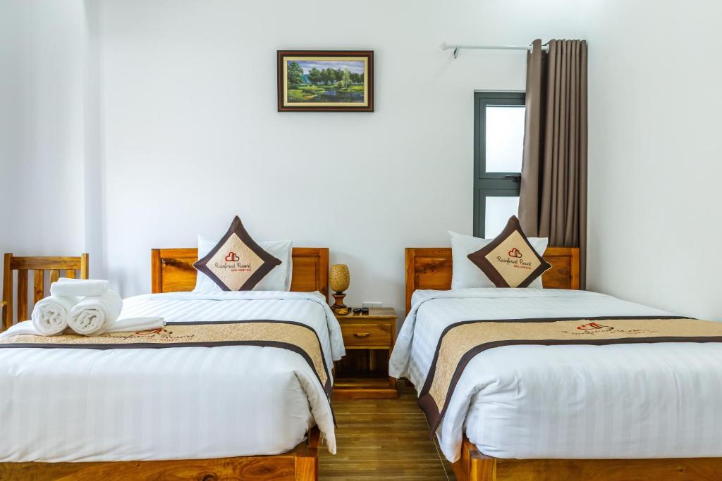 Postel nebo postele na pokoji v ubytování Rainforest Resort Phu Quoc
