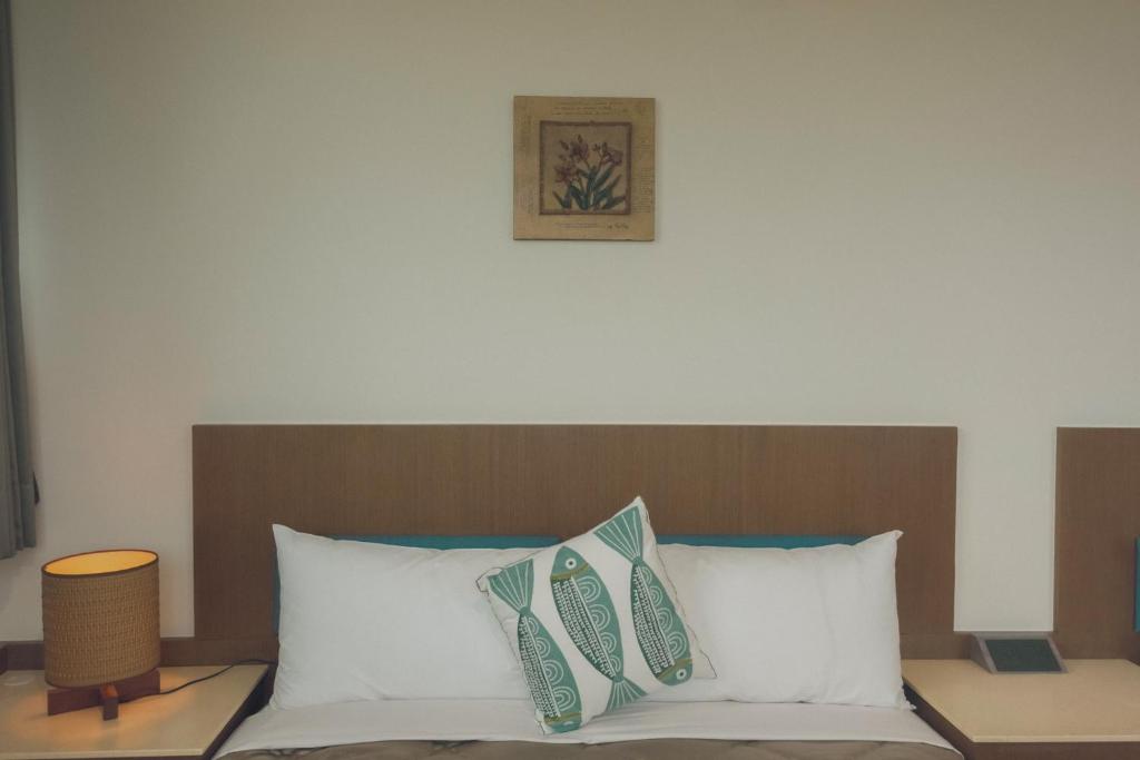 Postel nebo postele na pokoji v ubytování SongHo Hotel