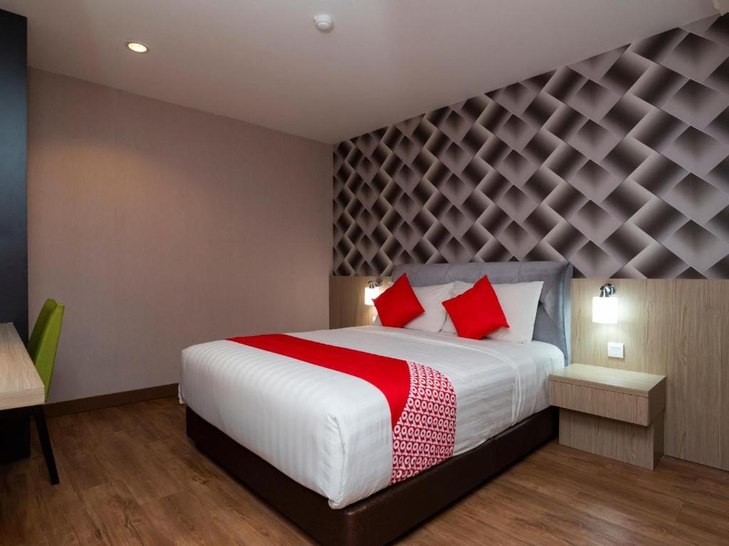 Postel nebo postele na pokoji v ubytování Hotel 101 Ulu Tiram