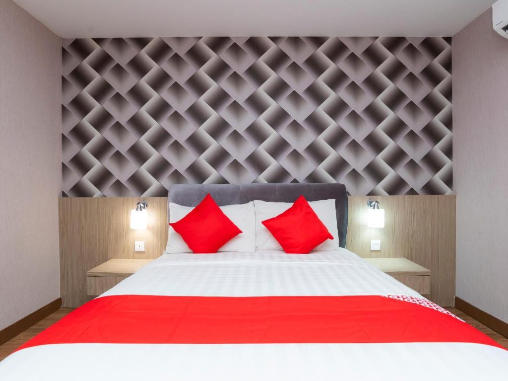 Postel nebo postele na pokoji v ubytování Hotel 101 Ulu Tiram
