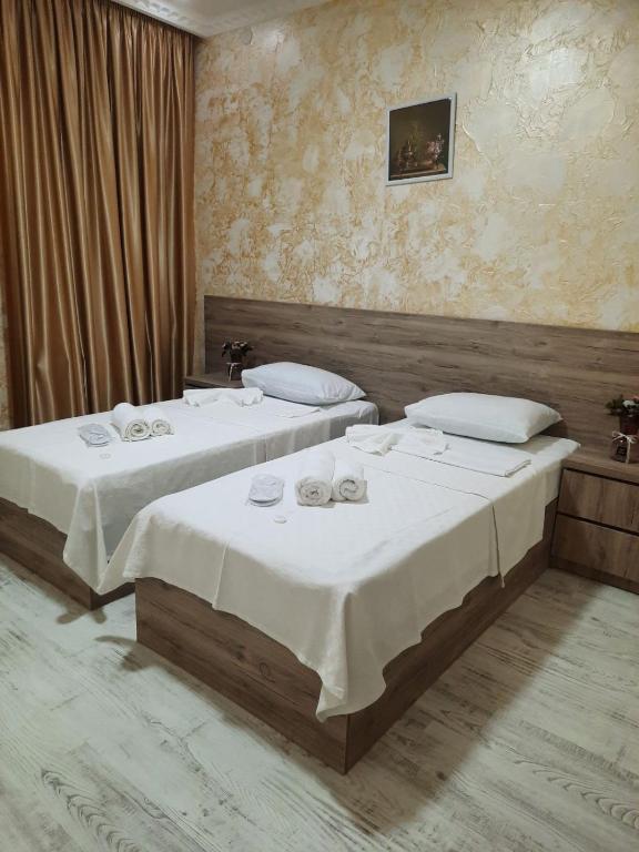 Llit o llits en una habitació de Inaisi Hotel