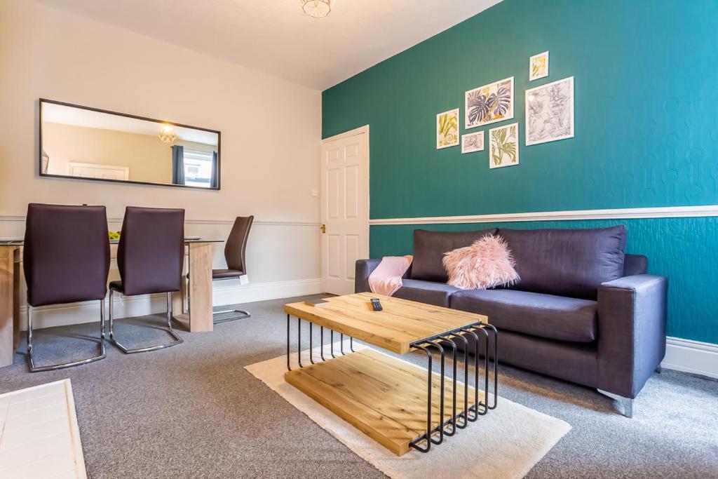 a living room with a couch and a table at Luke Stays - Saint Aidans Street in Gateshead