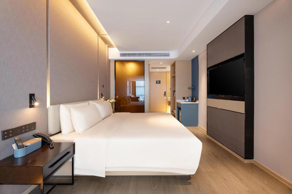 Postel nebo postele na pokoji v ubytování Atour Hotel Nanning Wuxiang Headquarter Base