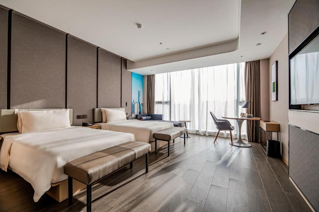Postel nebo postele na pokoji v ubytování Atour S Hotel Shenzhen Longgang Zhonghaixing