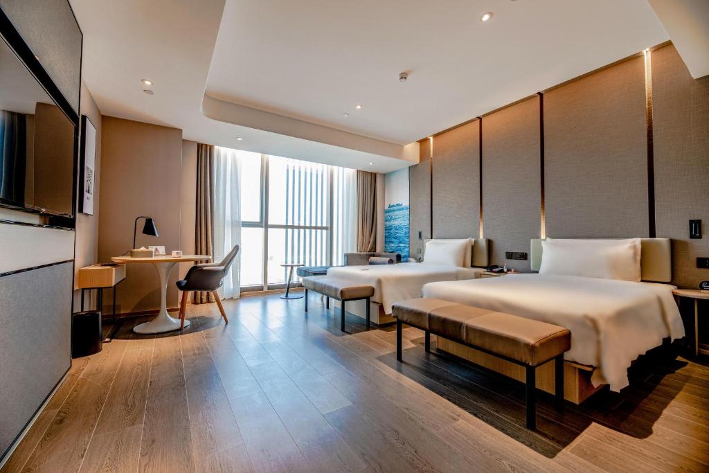 Postel nebo postele na pokoji v ubytování Atour S Hotel Shenzhen Longgang Zhonghaixing