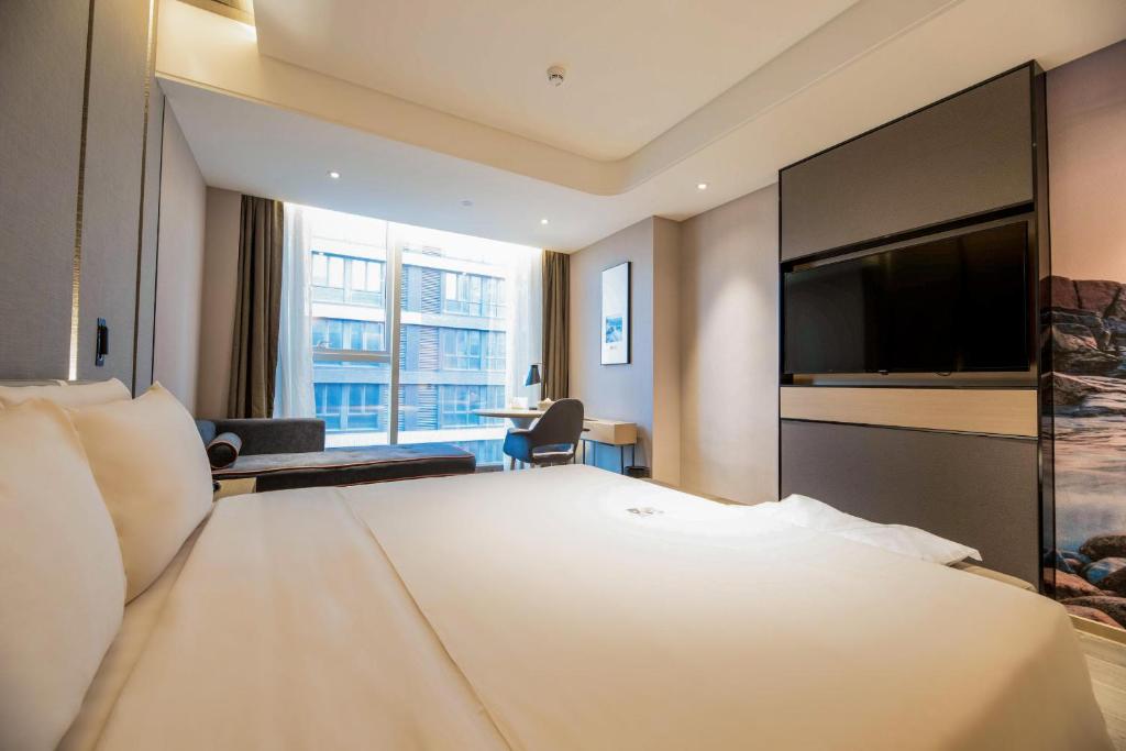 TV a/nebo společenská místnost v ubytování Atour S Hotel Shenzhen Longgang Zhonghaixing