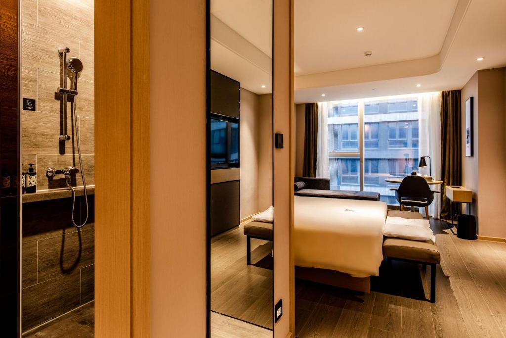 TV a/nebo společenská místnost v ubytování Atour S Hotel Shenzhen Longgang Zhonghaixing