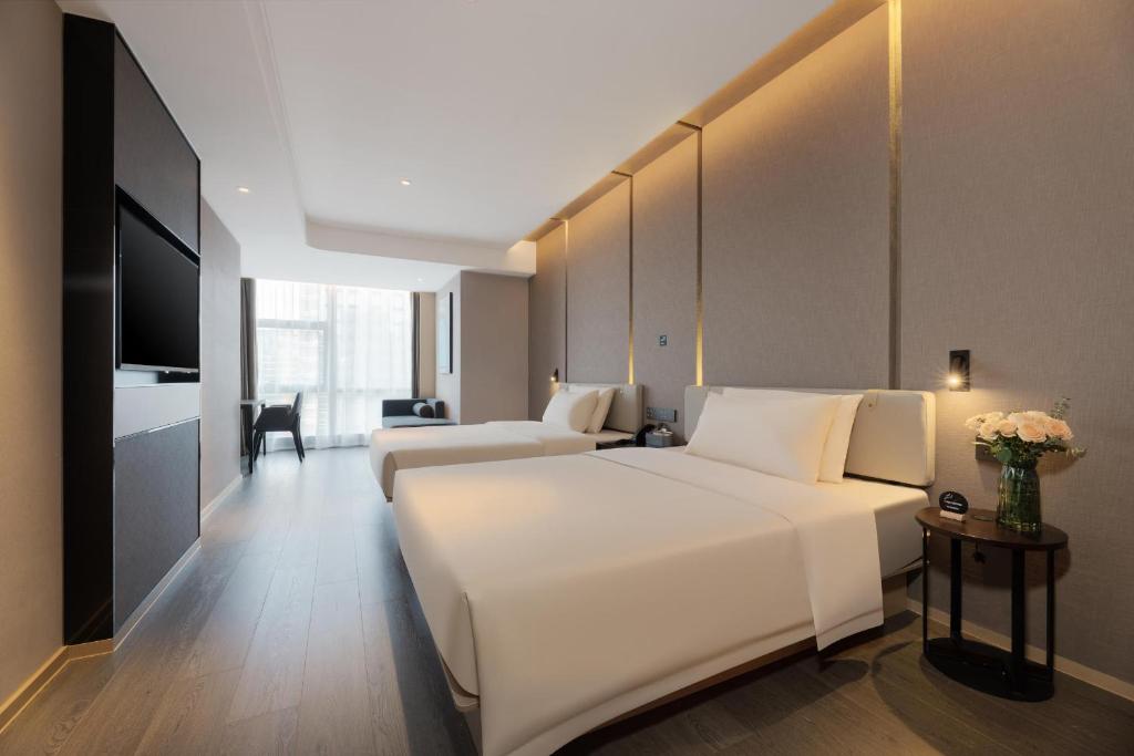 Postel nebo postele na pokoji v ubytování Atour Hotel Nanning Wuxiang Headquarter Base