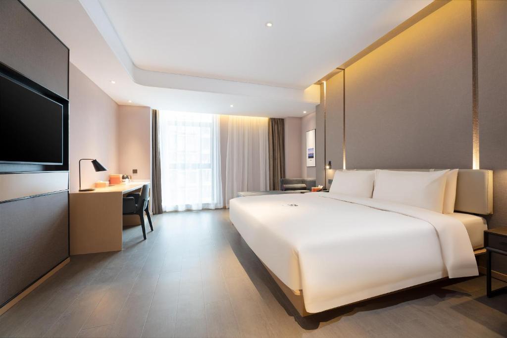 Postel nebo postele na pokoji v ubytování Atour Hotel Xian Software Park High-Tech 3rd Road