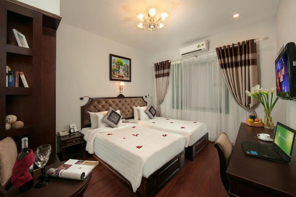 Postel nebo postele na pokoji v ubytování Labevie Hotel