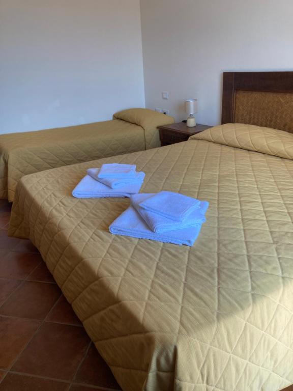 Postel nebo postele na pokoji v ubytování Hotel Funtana Ena