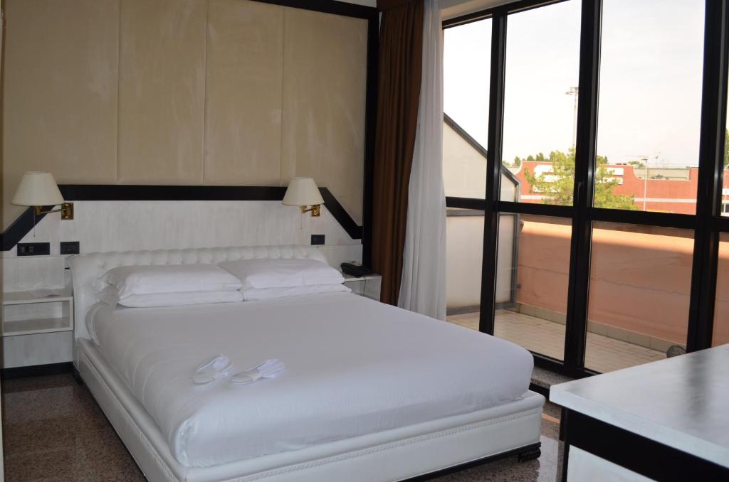 Postel nebo postele na pokoji v ubytování Hotel Diamante