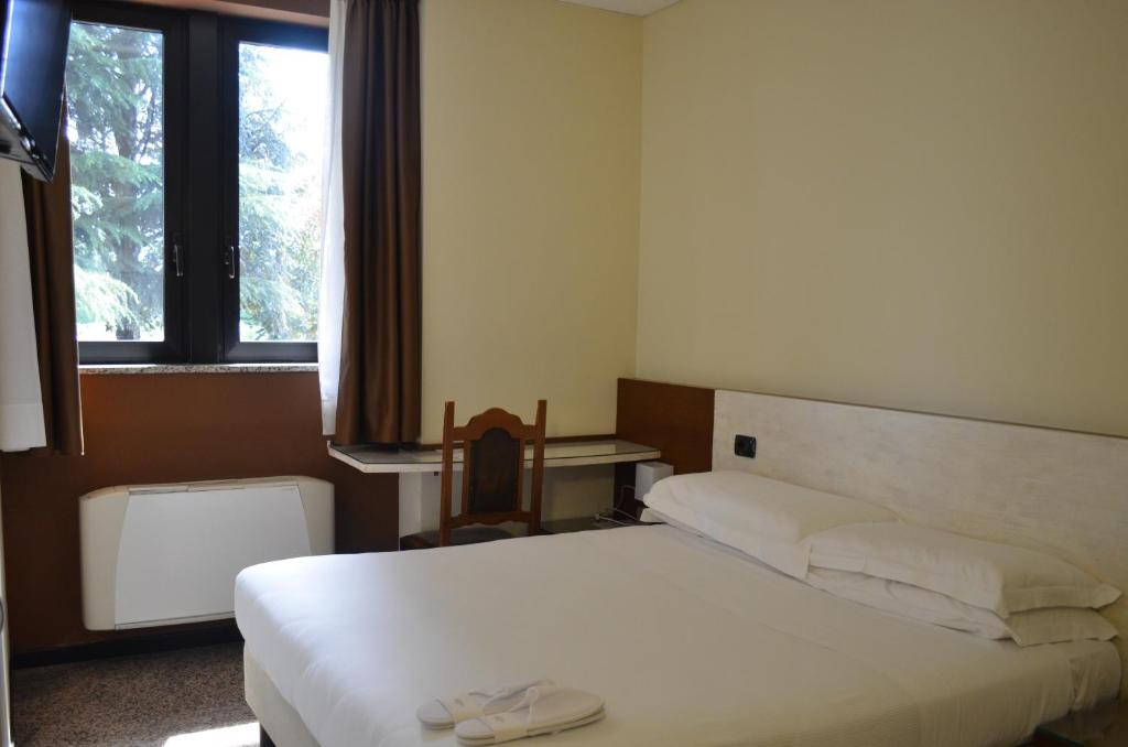 Postel nebo postele na pokoji v ubytování Hotel Diamante