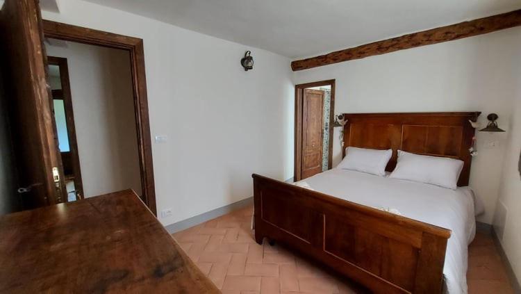 Postel nebo postele na pokoji v ubytování LA CA' DEI COMARI - Locanda da Tullio