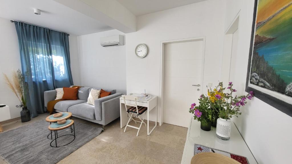 a living room with a couch and a table at Korčula - apartman 2, Prigradica - IVAN in Blato